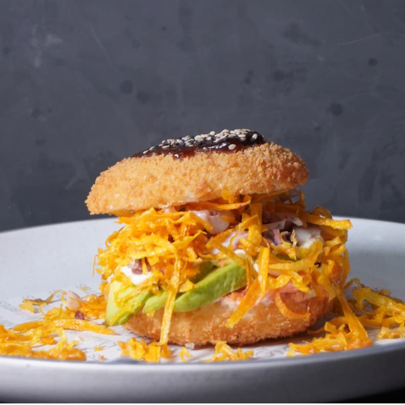 Sushi Burger with crispy rice buns, salmon, shrimp, squid, nothing raw at Tampa’s Sushi Bites.